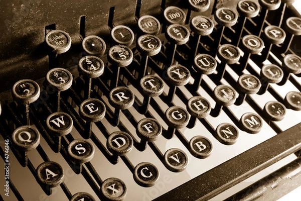 Fototapeta Vintage Typewriter with sepia cast showing most keys