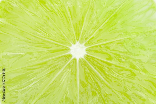 Fototapeta Green lime slice macro closeup background texture