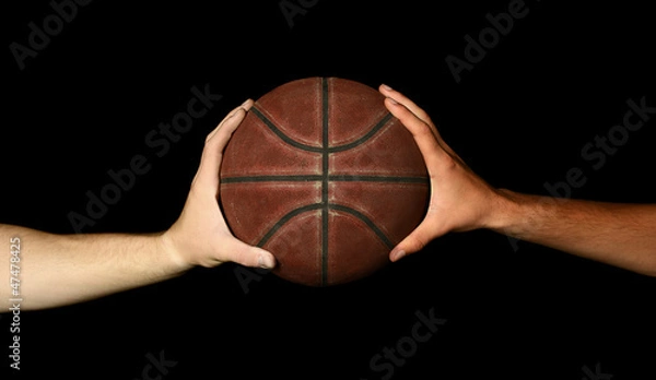 Obraz Two hands holding basketball