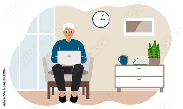 Fototapeta Grandfather is sitting with a laptop on an armchair at home. I work on a computer. Online education, training or social media concept.