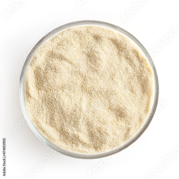 Fototapeta Semolina flour in glass bowl isolated on white background with clipping path