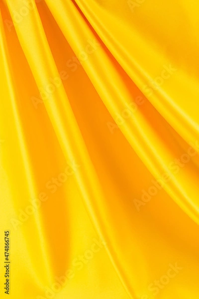 Fototapeta draped yellow silk fabric of satin weave, texture, background