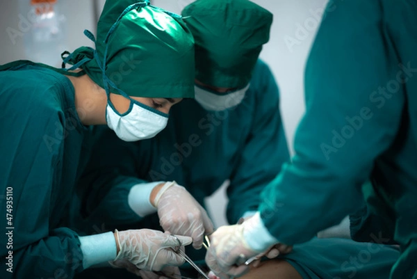 Fototapeta Anesthetist surgery doctor professional team are working in hospital operating room