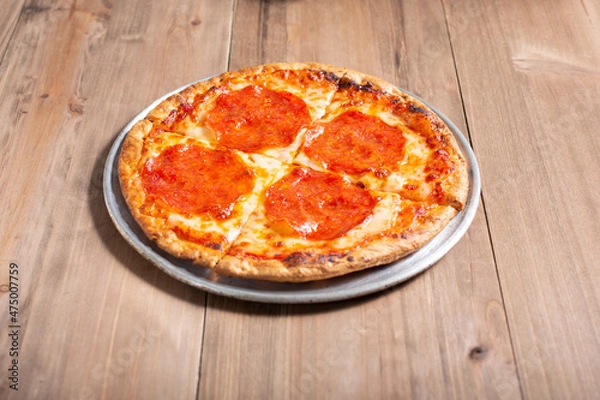 Fototapeta A view of a children's size personal pizza.