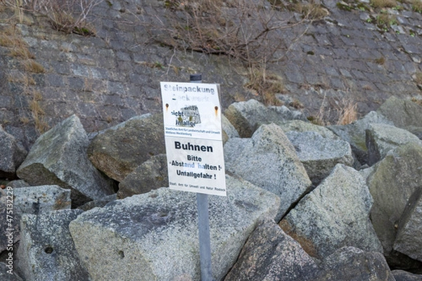 Obraz Schild vor Steinwand