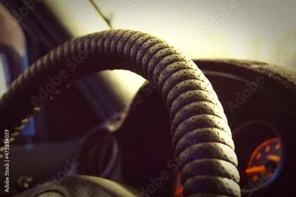 Fototapeta steering wheel inside the car with bokeh effect
