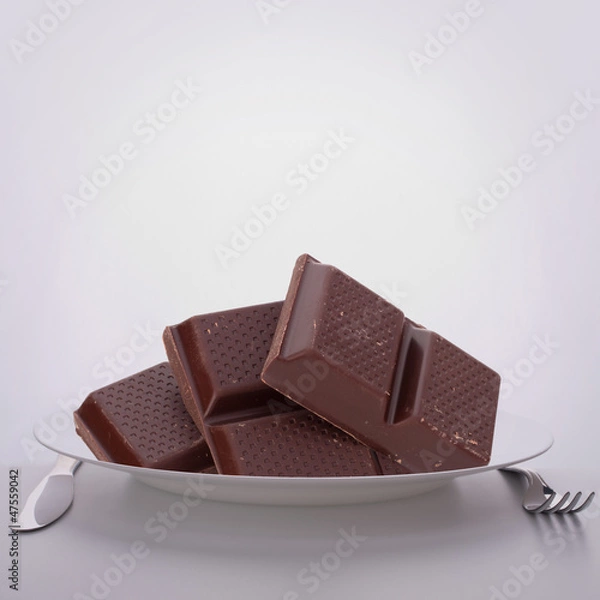 Fototapeta Chocolate bars stack on plate.