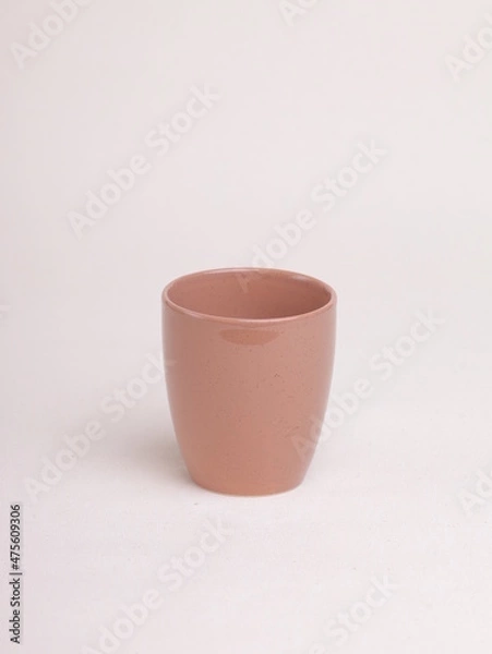 Obraz orange tea cup on a light background