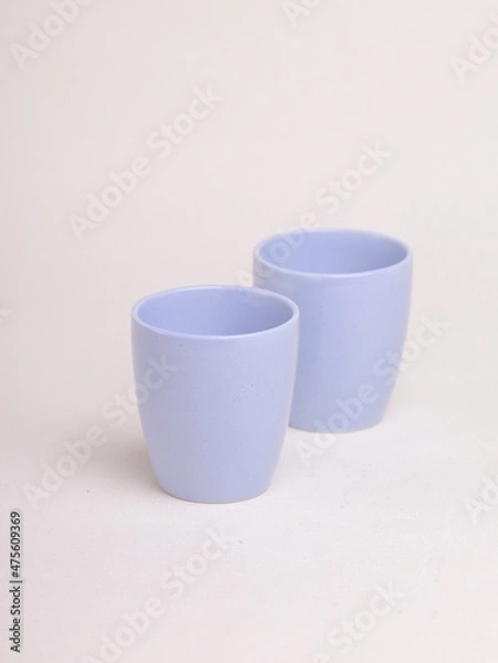 Obraz purple ceramic cup on a light background