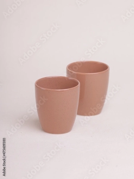 Obraz brown ceramic cup on a light background
