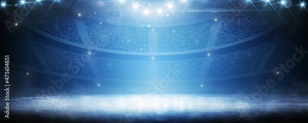 Fototapeta Sport background. Blue ice floor texture and mist. Snow and ice background. Empty ice rink illuminated by spotlights. Scene Illumination