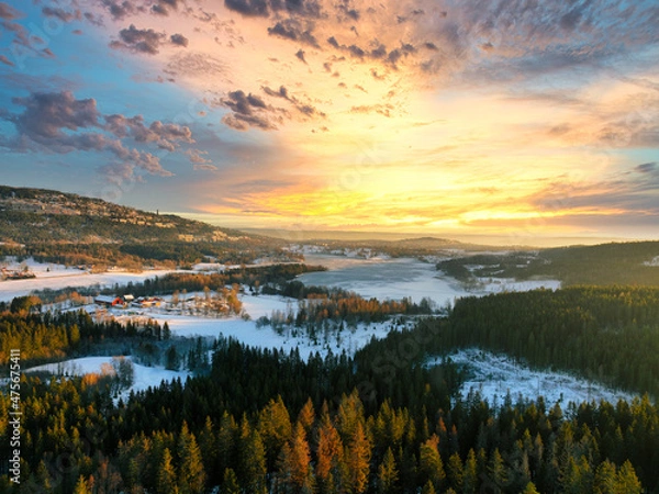Fototapeta Sunrise over Oslo, Norway. Shot just outside of the city a winter morning in December. Shot high up in the sky with a drone. DJI Mavic 3