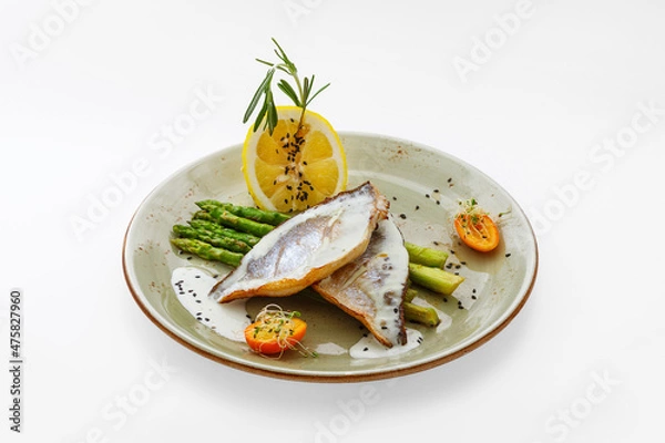 Fototapeta Seafood on a plate, food on a white background isolated - healthy food, asparagus, lemon. Nutrition for a healthy lifestyle