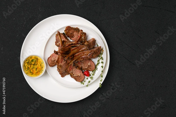 Obraz Overhead view of grilled rack of lamb on a plate