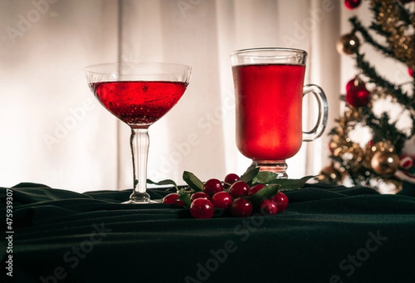 Fototapeta Red fruit flavored cider accompanied by cherries, on an elegant black cloth
