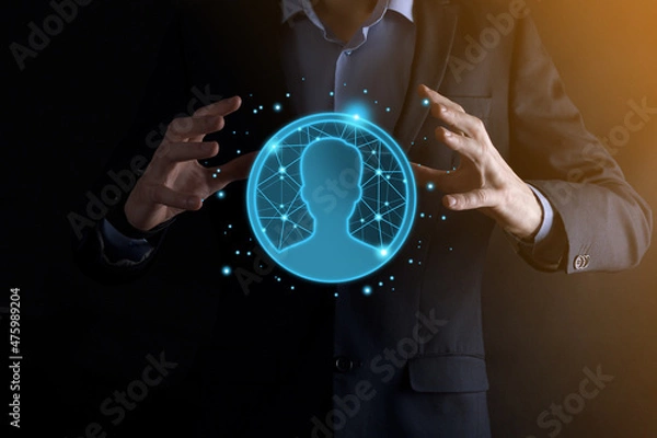 Fototapeta Businessman holding on hand icon of user man,woman low poly polygon style. Internet icons interface foreground. global network media concept.