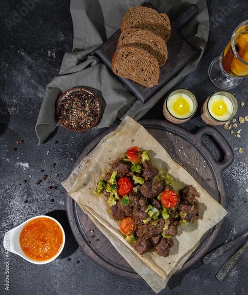 Fototapeta roasted beef slices, bread, sauces and tea with lemon and cinnamon