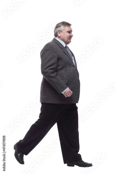 Fototapeta business man confidently striding forward . isolated on a white