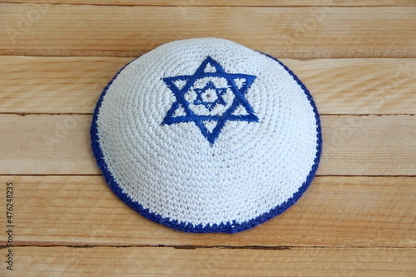 Obraz Jewish kippah hat with star of David on wooden background