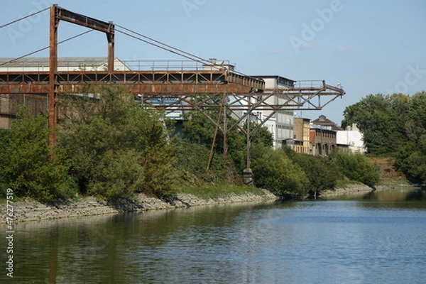 Fototapeta Old buildings and rustic framework structure in Mannheim Bonadieshafen harbour, Mannheim, Baden Wurttemberg, Germany