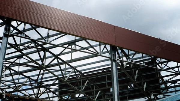Obraz Steel frame work of new commercial building under construction.