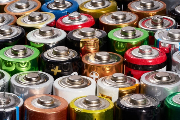 Fototapeta Row of colorful used batteries.Recycling concept.