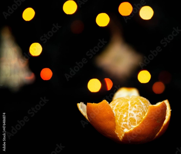 Fototapeta new year tangerines and garlands with bokeh