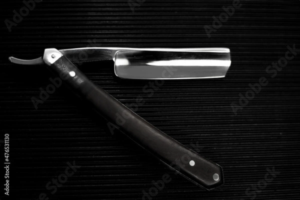 Obraz barber tool straight razor close in retro vintage style. Black and white picture