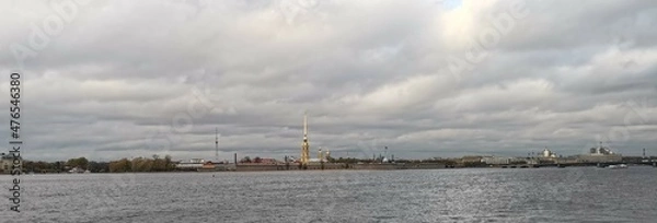 Fototapeta Peter and Paul Fortress in Saint Petersburg, Russia, As Seen from Neva River with Bell Tower of Saints Peter and Paul Cathedral On a Cloudy Autumn Day.