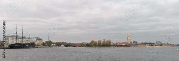 Fototapeta Peter and Paul Fortress in Saint Petersburg, Russia, As Seen from Neva River with Bell Tower of Saints Peter and Paul Cathedral On a Cloudy Autumn Day.