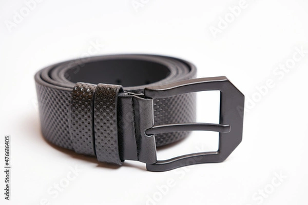 Fototapeta Big black leather belt with a metal buckle on a white background.