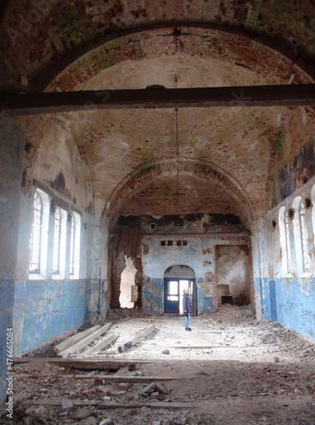 Fototapeta A man inside an abandoned temple