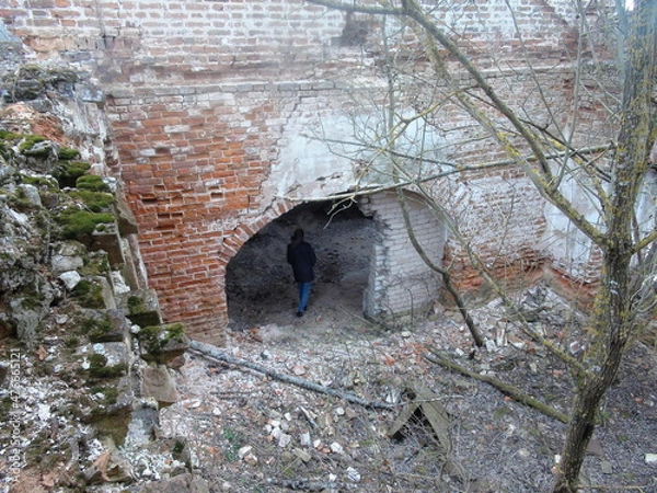 Fototapeta A man inside an abandoned temple