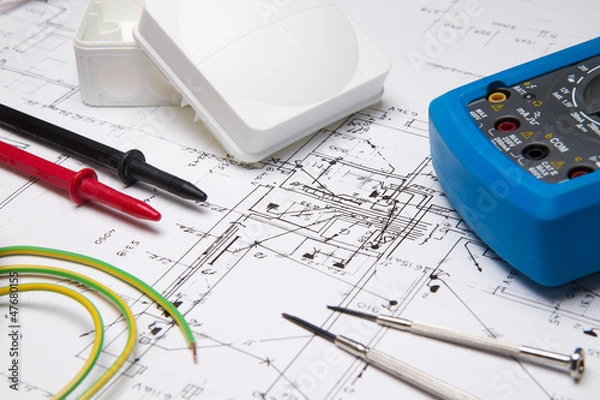 Fototapeta Electrical instruments laying on blueprint