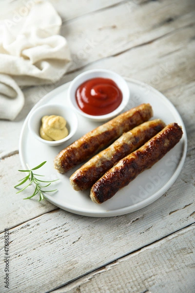 Obraz Homemade roasted sausages with ketchup and mustard