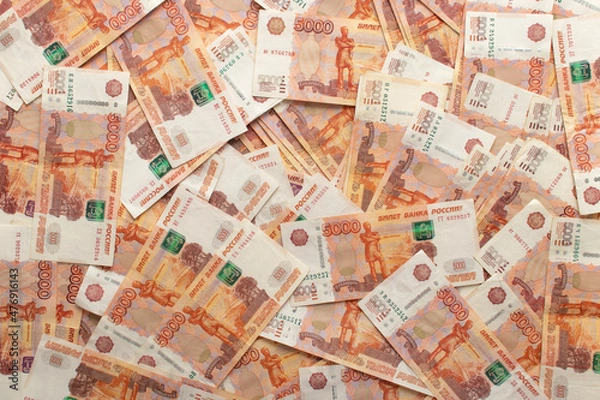 Obraz Top view of a pile of five thousand banknotes of Russian rubles. Inverted bills. Soft light.