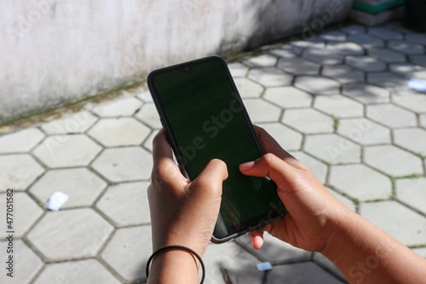 Obraz person using mobile phone