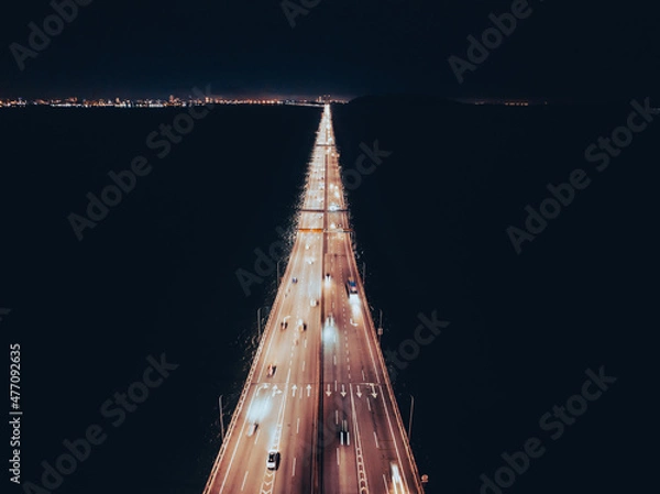 Fototapeta Night top view of the bridge illuminated by road lights