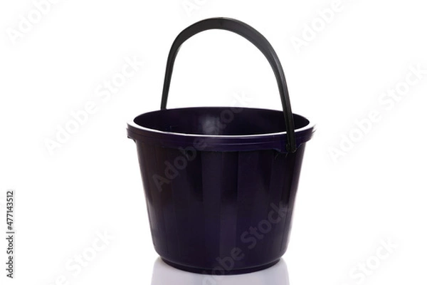 Fototapeta black empty bucket with handle on white plastic background