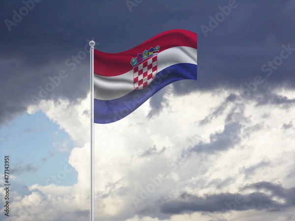 Fototapeta Flag of the Croatia on a stick, dark clouds in the background
