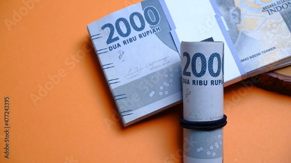 Fototapeta Indonesian Rupiah the official currency of Indonesia. Business and finance concept, Uang 2000 Rupiah Bank Indonesia. Uang Rupiah.