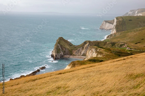 Fototapeta Man O'War beach near Durdle Door as seen from the coastal path from Lulworth Cove with Bat's Head in the distance.