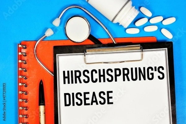 Fototapeta Hirschsprung's disease. An inscription in a folder with a medical diagnosis, against the background of a stethoscope and medications.