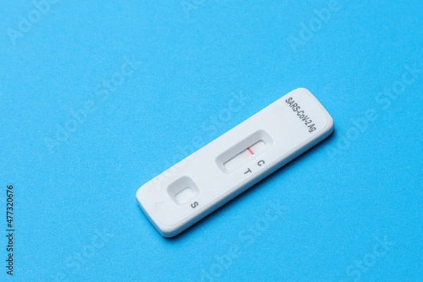 Obraz Negative antigen rapid test on blue background