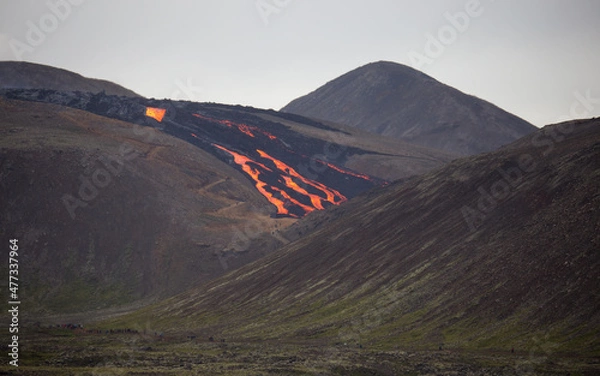 Obraz lava flow behind people