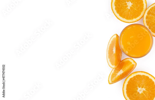 Fototapeta fresh citrus juice in a glass. Slices of oranges and tangerines on a white background