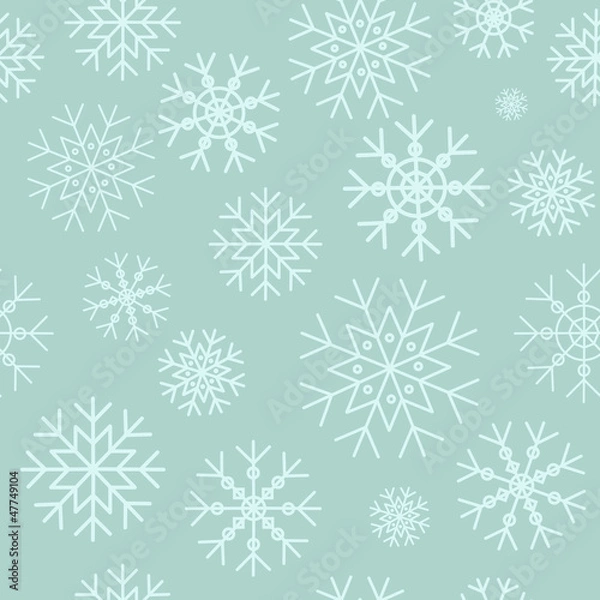 Obraz White snowflakes on a blue background