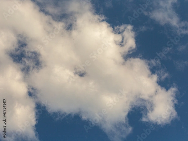 Fototapeta The evening sky, sunlight breaks through clouds and clouds, creating all kinds of forms of air masses. -