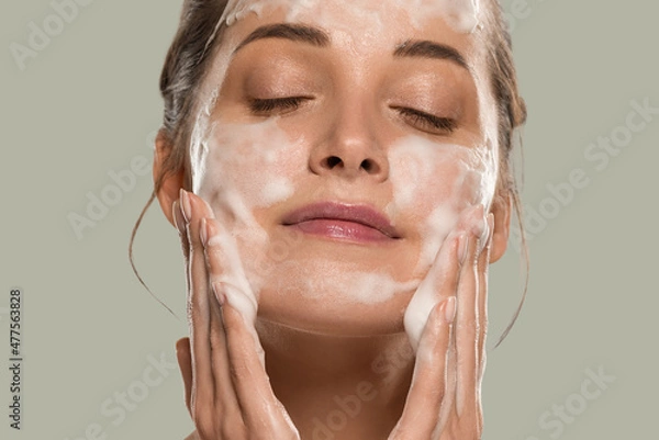 Fototapeta Soap face woman clean skin beauty. Color background. Green