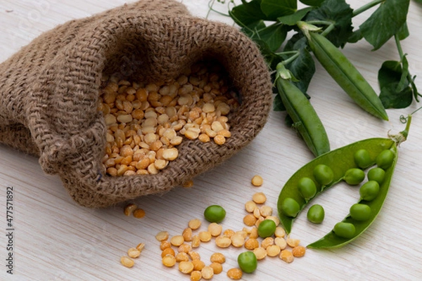 Obraz Healthy fresh green peas and pea groats on rustic wooden background